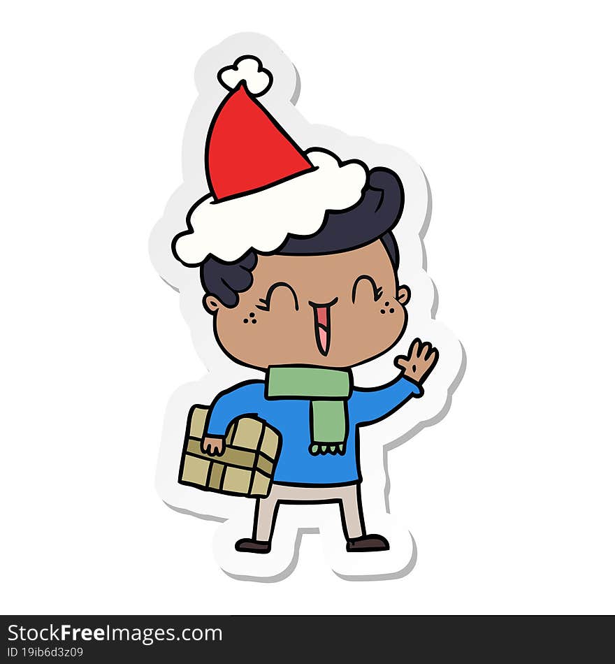 sticker cartoon of a laughing boy wearing santa hat