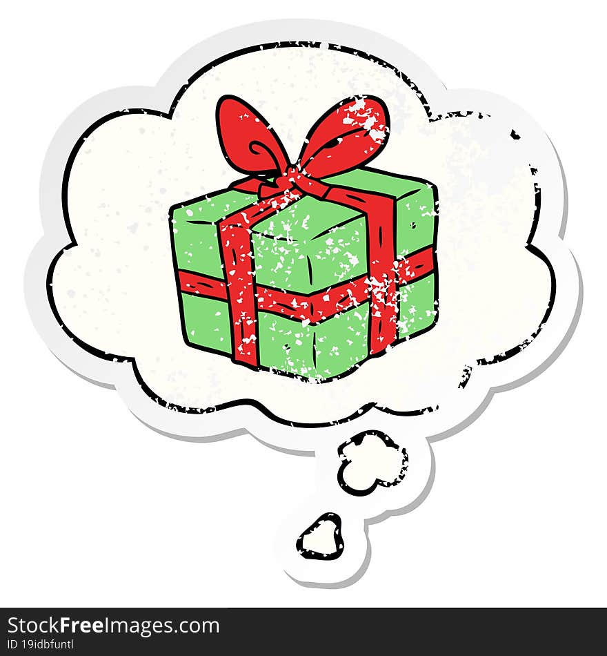 cartoon wrapped gift with thought bubble as a distressed worn sticker