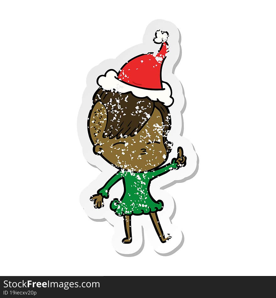 Distressed Sticker Cartoon Of A Squinting Girl Wearing Santa Hat