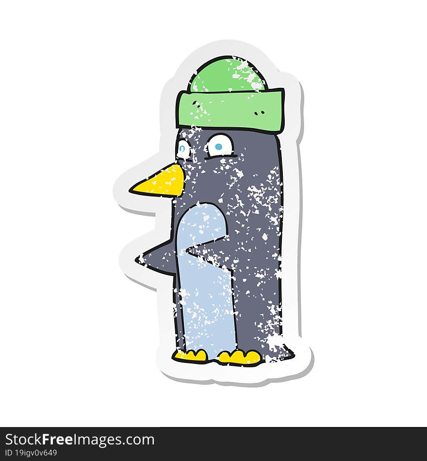 retro distressed sticker of a cartoon penguin wearing hat