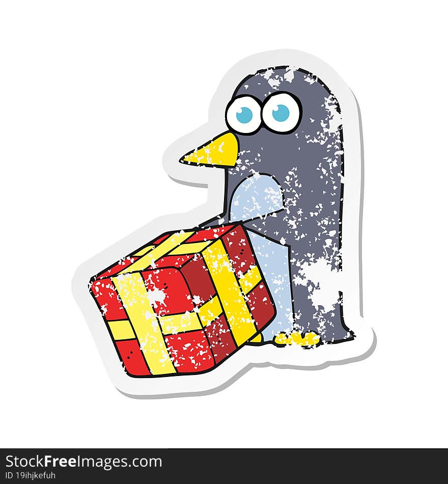 Retro Distressed Sticker Of A Cartoon Penguin With Christmas Present