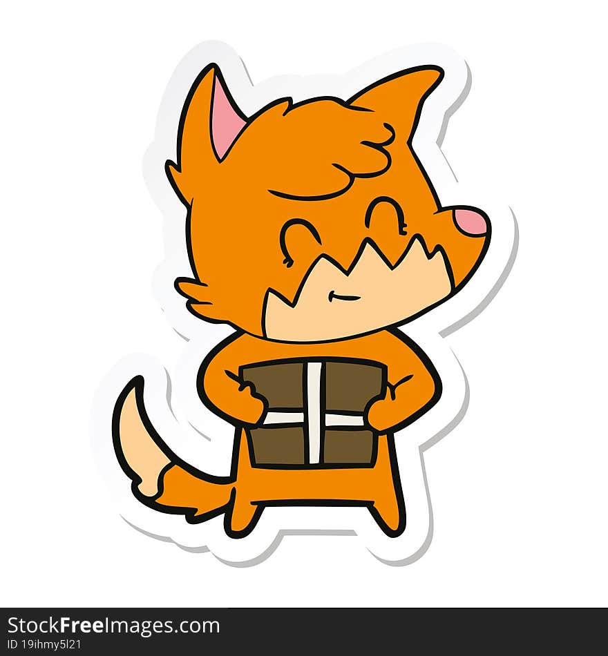 sticker of a cartoon friendly fox with gift