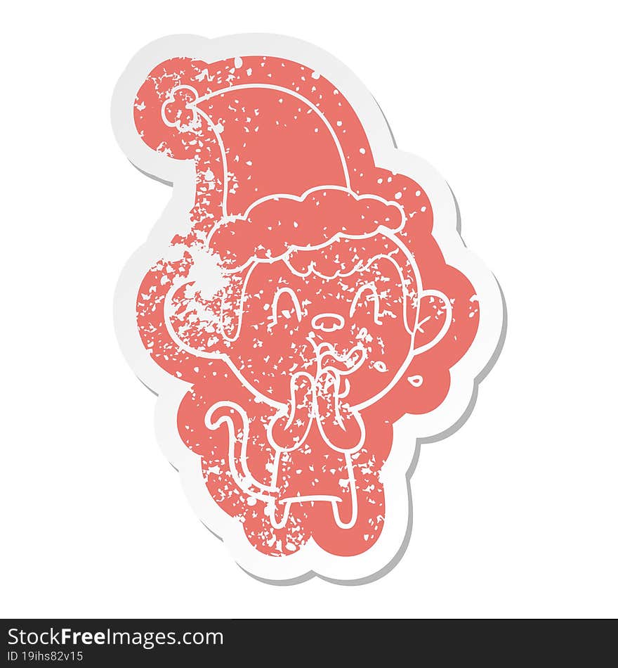 crazy cartoon distressed sticker of a monkey wearing santa hat