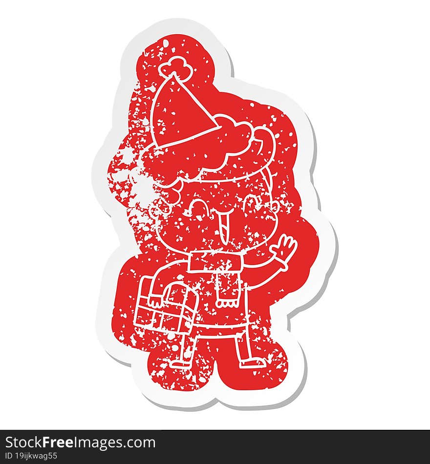 Cartoon Distressed Sticker Of A Laughing Boy Wearing Santa Hat