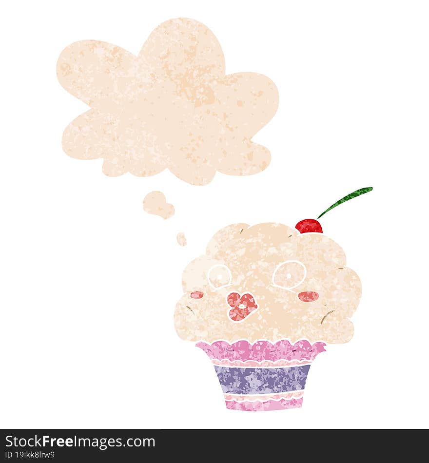 cartoon cupcake and thought bubble in retro textured style