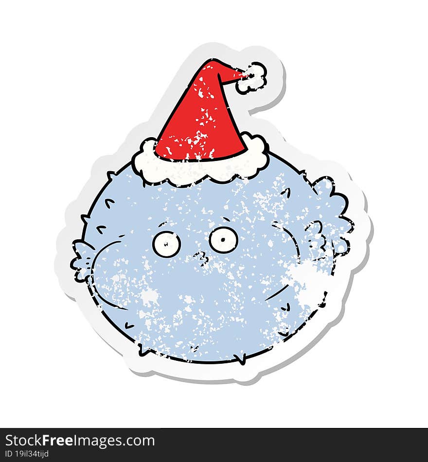 Distressed Sticker Cartoon Of A Puffer Fish Wearing Santa Hat