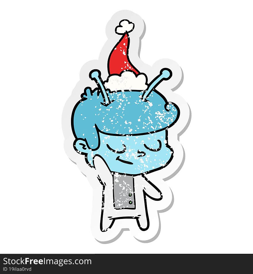 Friendly Distressed Sticker Cartoon Of A Spaceman Wearing Santa Hat