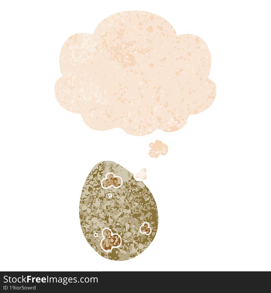 cartoon egg with thought bubble in grunge distressed retro textured style. cartoon egg with thought bubble in grunge distressed retro textured style