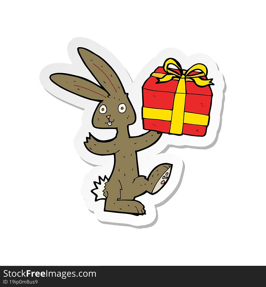 sticker of a cartoon rabbit with christmas present