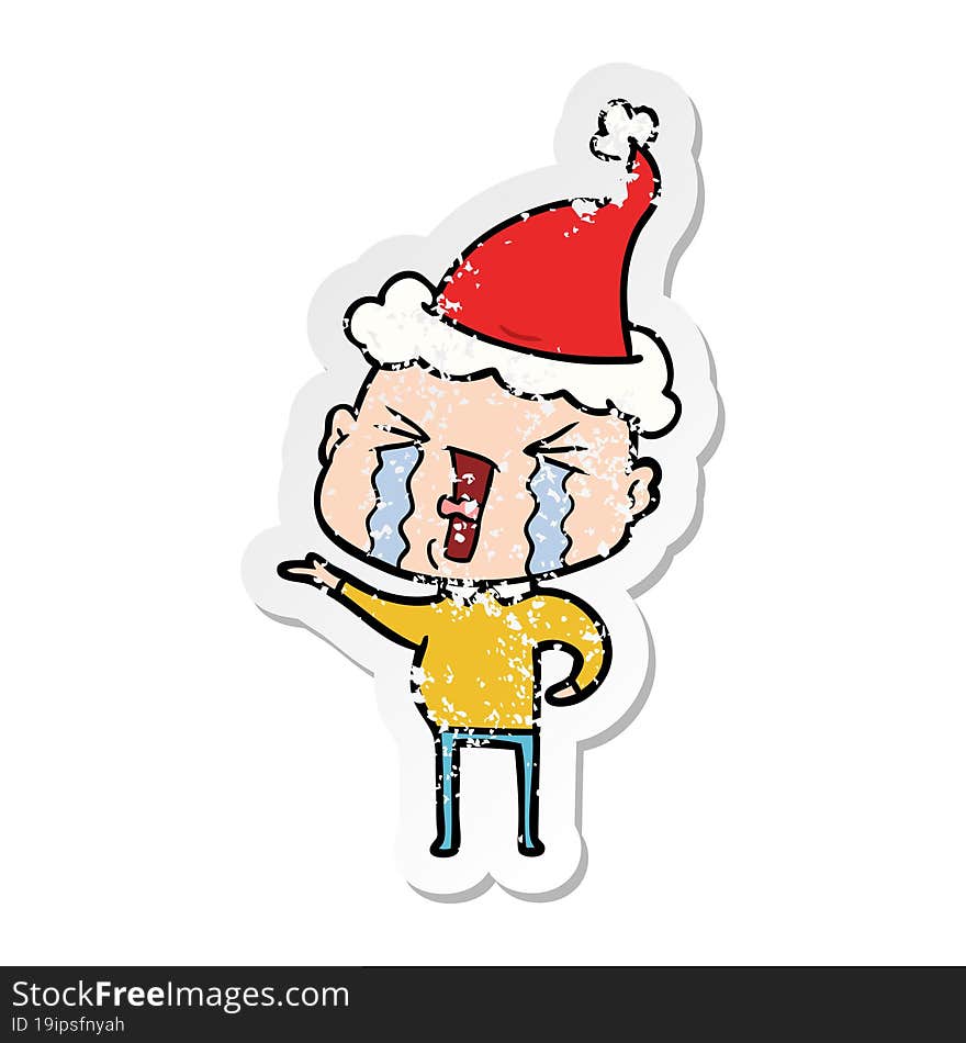 Distressed Sticker Cartoon Of A Crying Bald Man Wearing Santa Hat