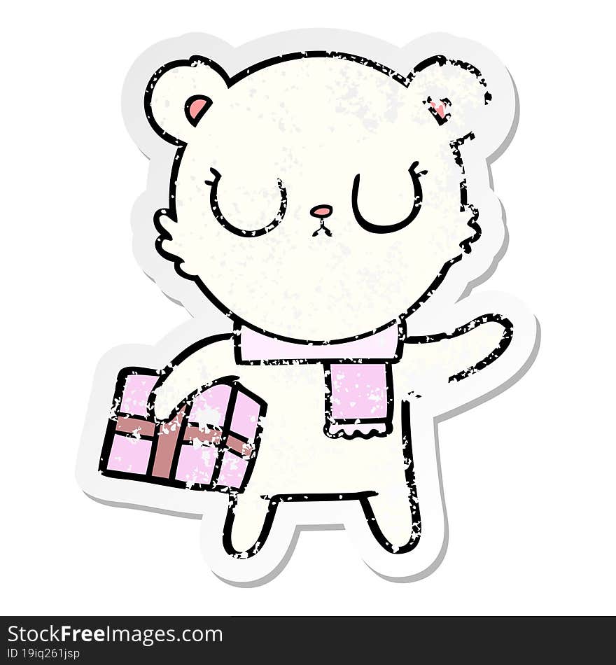 Distressed Sticker Of A Peaceful Cartoon Polar Bear With Christmas Gift