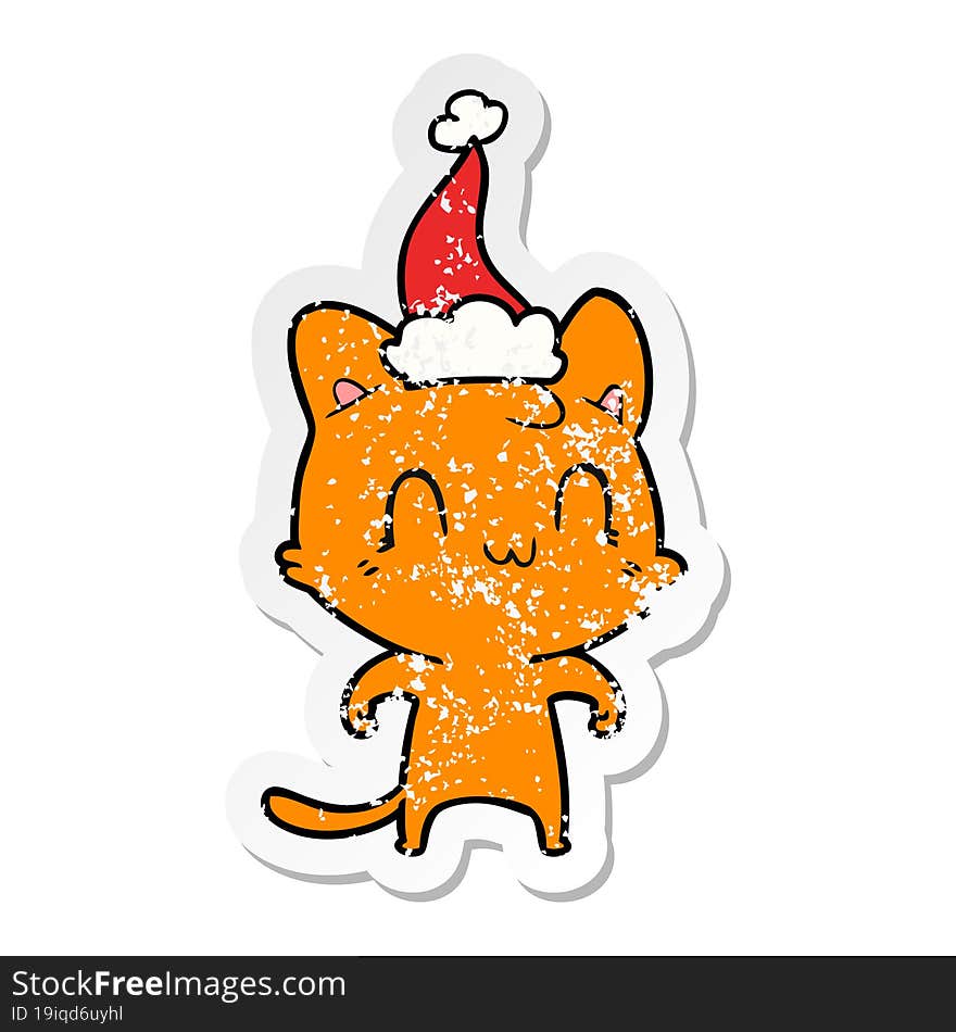 distressed sticker cartoon of a happy cat wearing santa hat