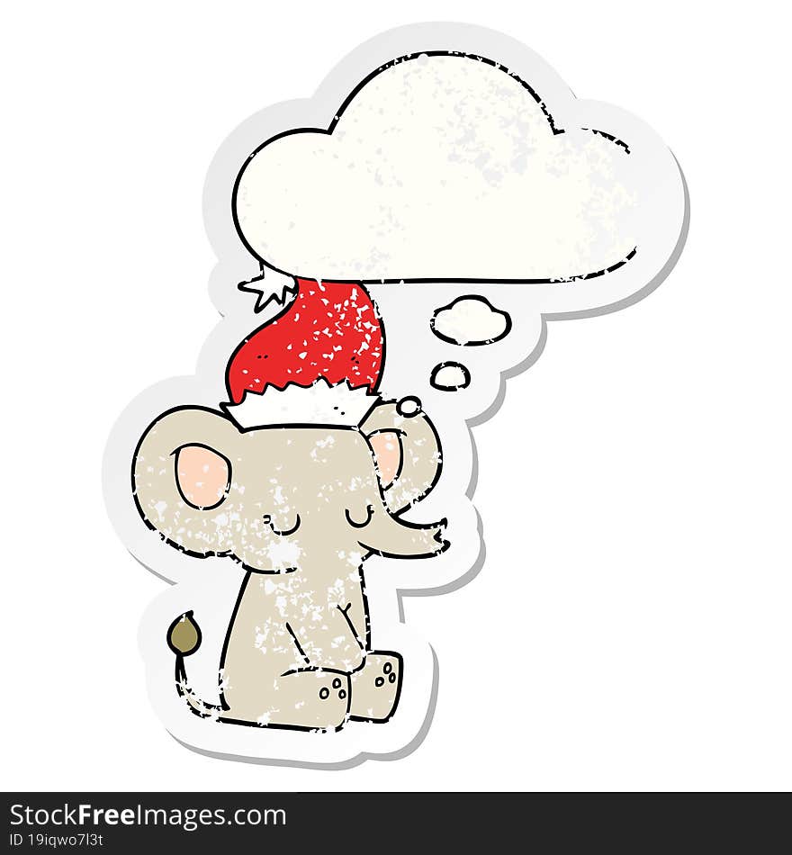 cute christmas elephant and thought bubble as a distressed worn sticker