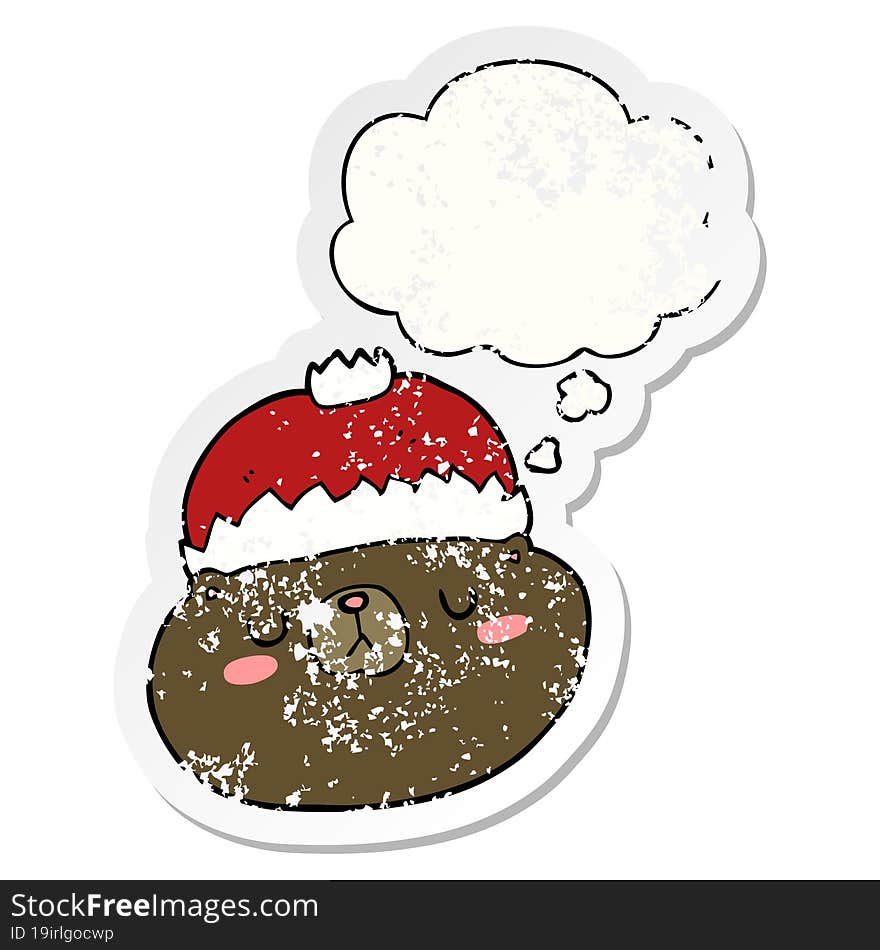 cartoon christmas bear and thought bubble as a distressed worn sticker