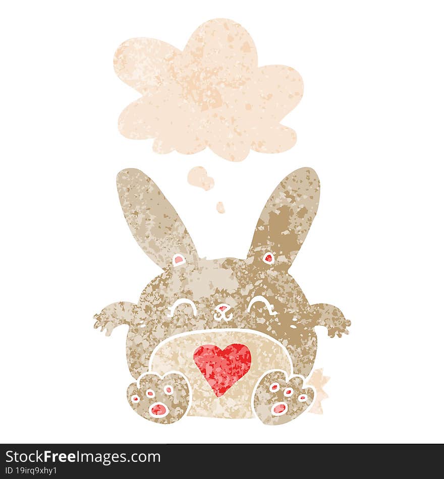 cute cartoon rabbit with love heart and thought bubble in retro textured style