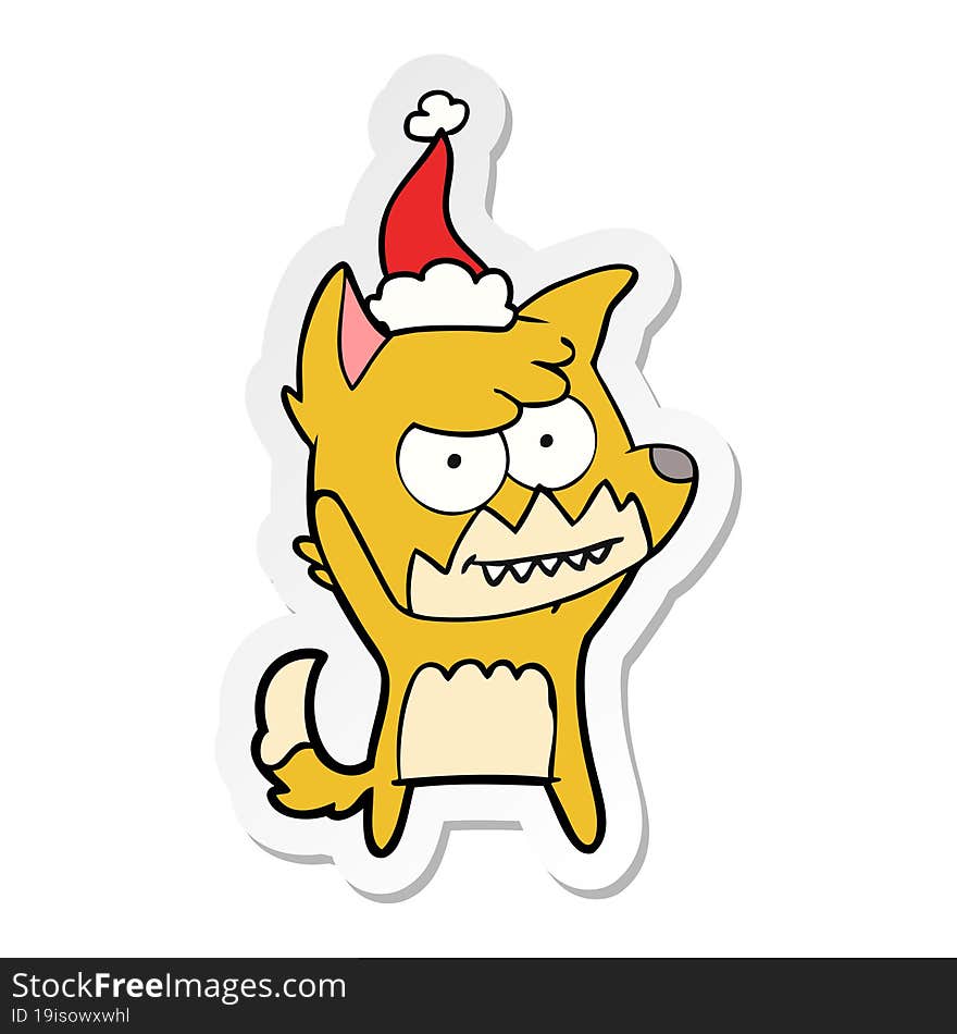 sticker cartoon of a grinning fox wearing santa hat