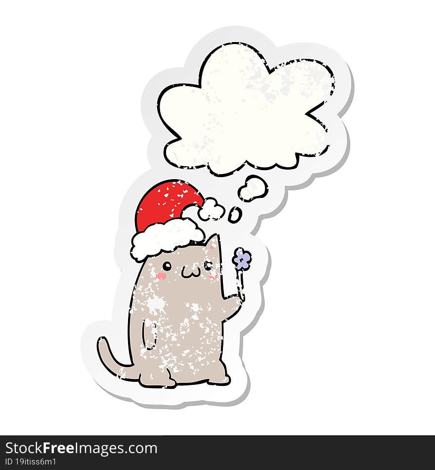 cute cartoon christmas cat and thought bubble as a distressed worn sticker