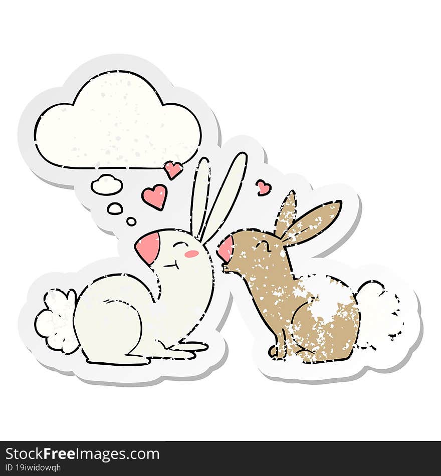 cartoon rabbits in love with thought bubble as a distressed worn sticker