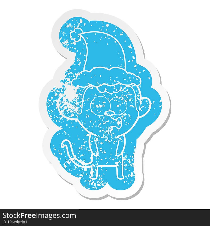 cartoon distressed sticker of a hooting monkey wearing santa hat