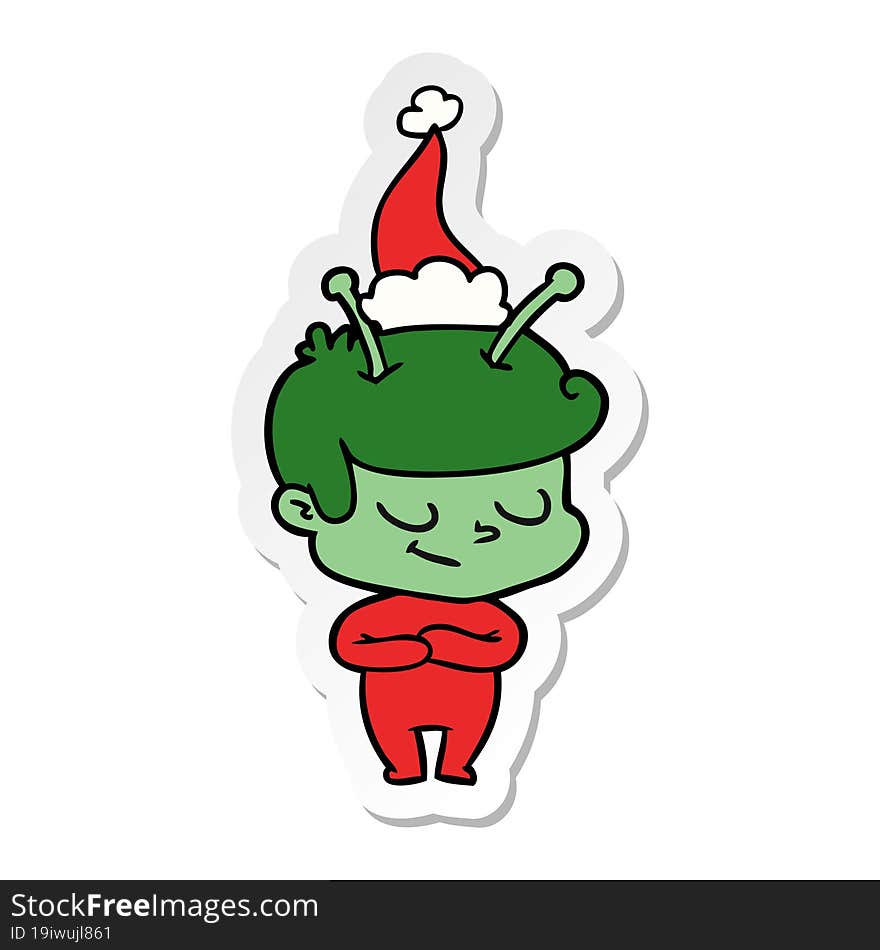 friendly sticker cartoon of a spaceman wearing santa hat