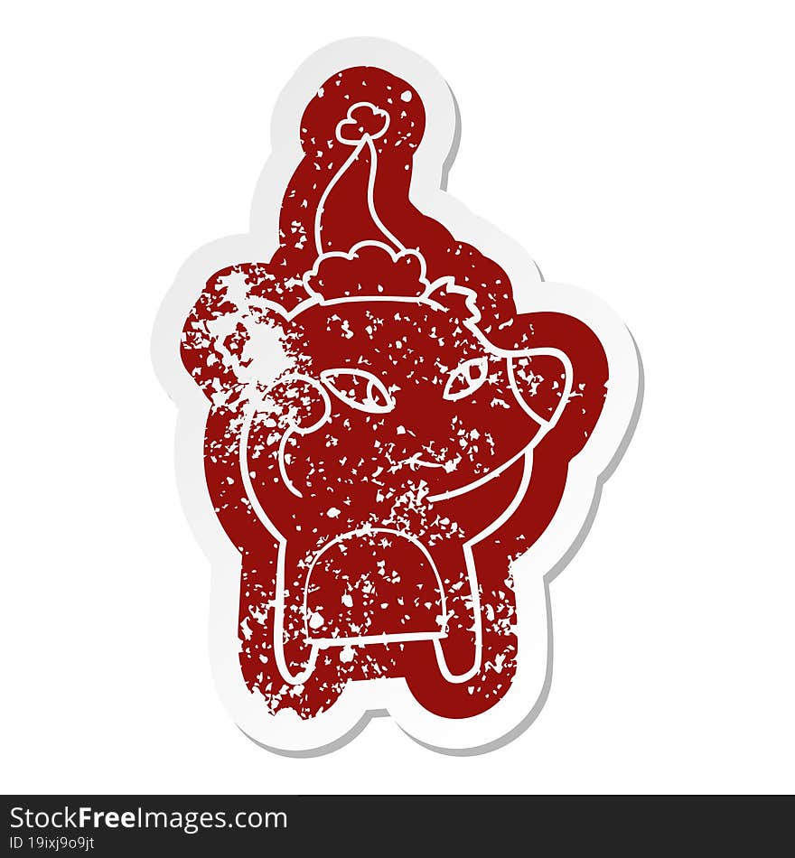 cute cartoon distressed sticker of a bear wearing santa hat