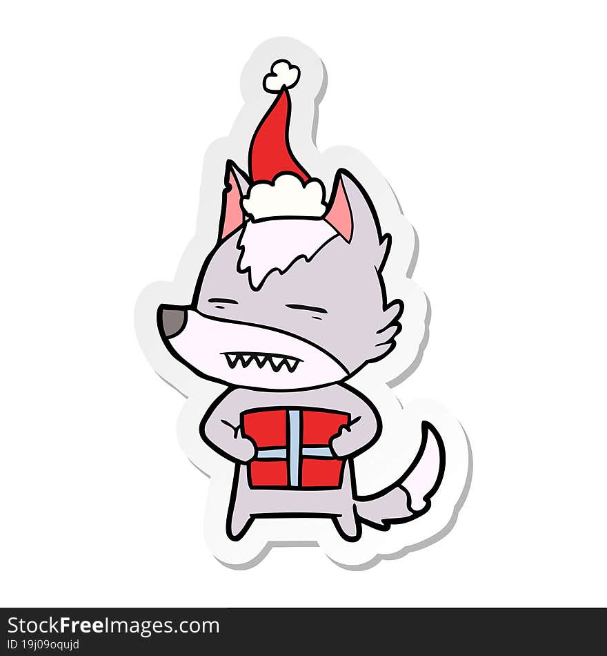 hand drawn sticker cartoon of a wolf with a gift wearing santa hat