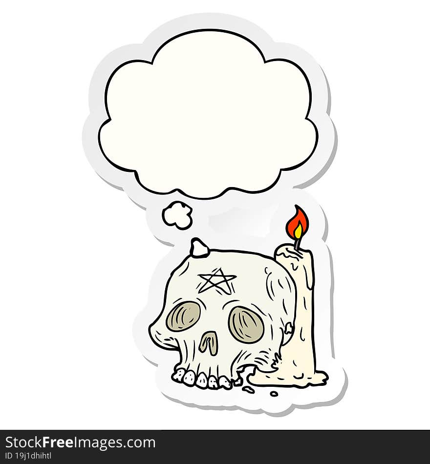 cartoon spooky skull and candle with thought bubble as a printed sticker