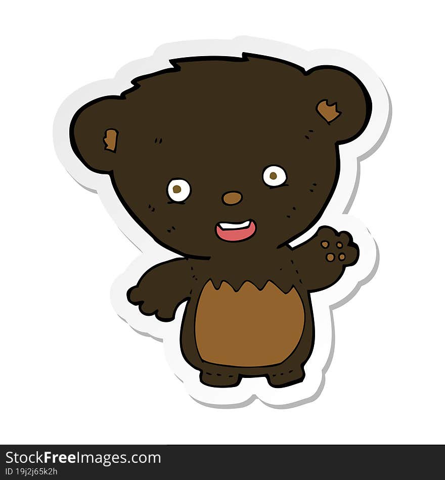 sticker of a cartoon black bearcub waving