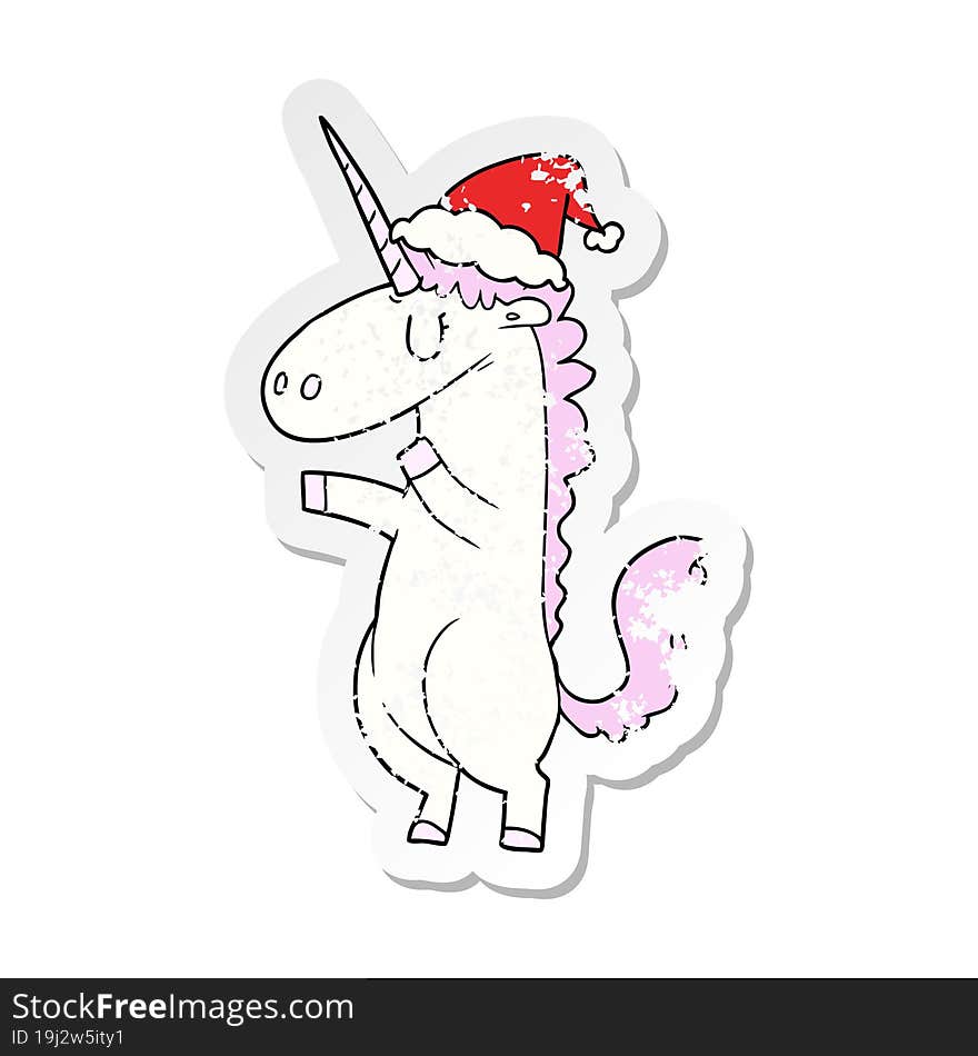 distressed sticker cartoon of a unicorn wearing santa hat