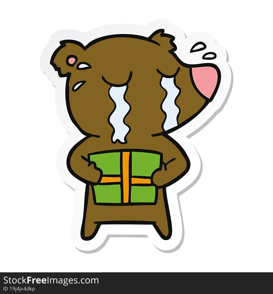 sticker of a cartoon crying bear with present