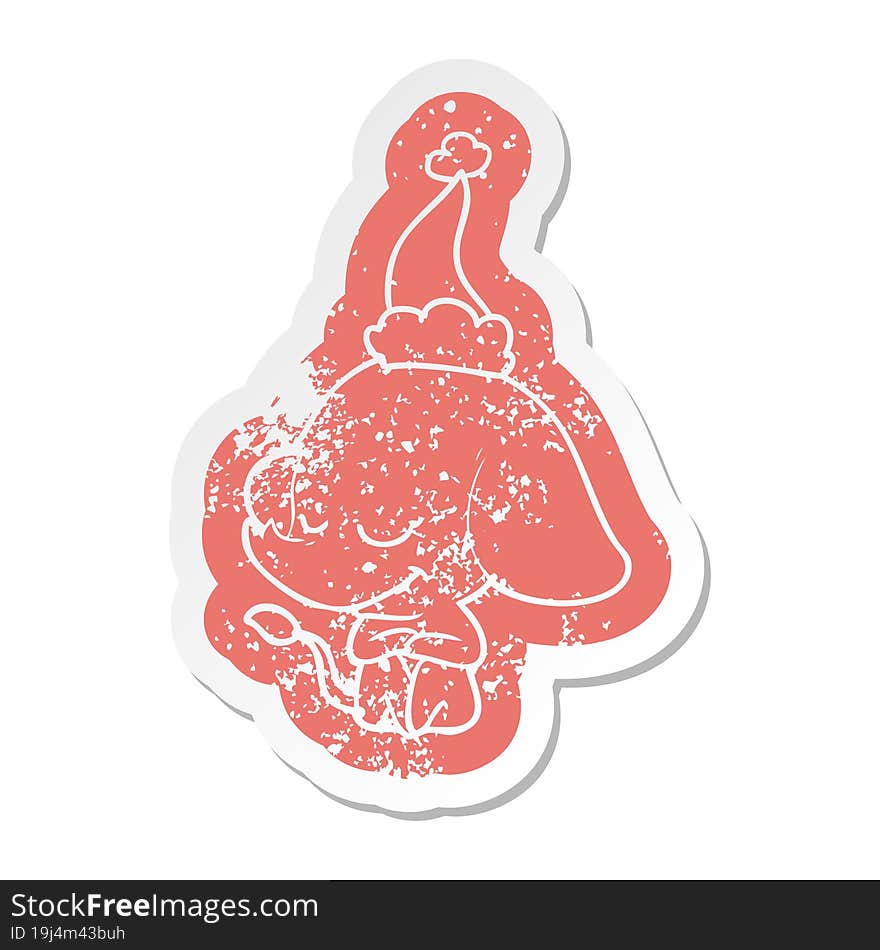 cartoon distressed sticker of a smiling elephant wearing santa hat