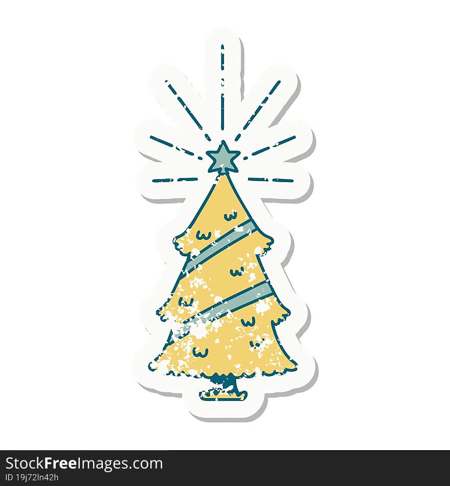 worn old sticker of a tattoo style christmas tree with star. worn old sticker of a tattoo style christmas tree with star