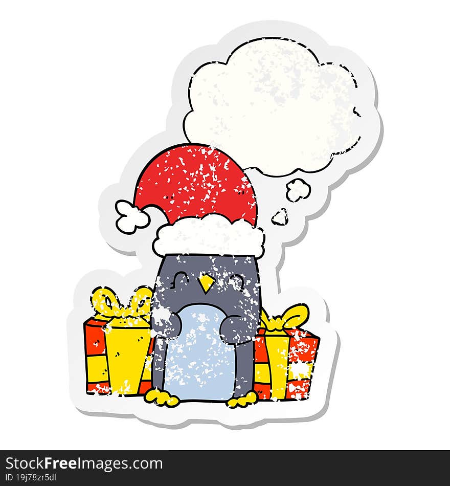 cute christmas penguin and thought bubble as a distressed worn sticker