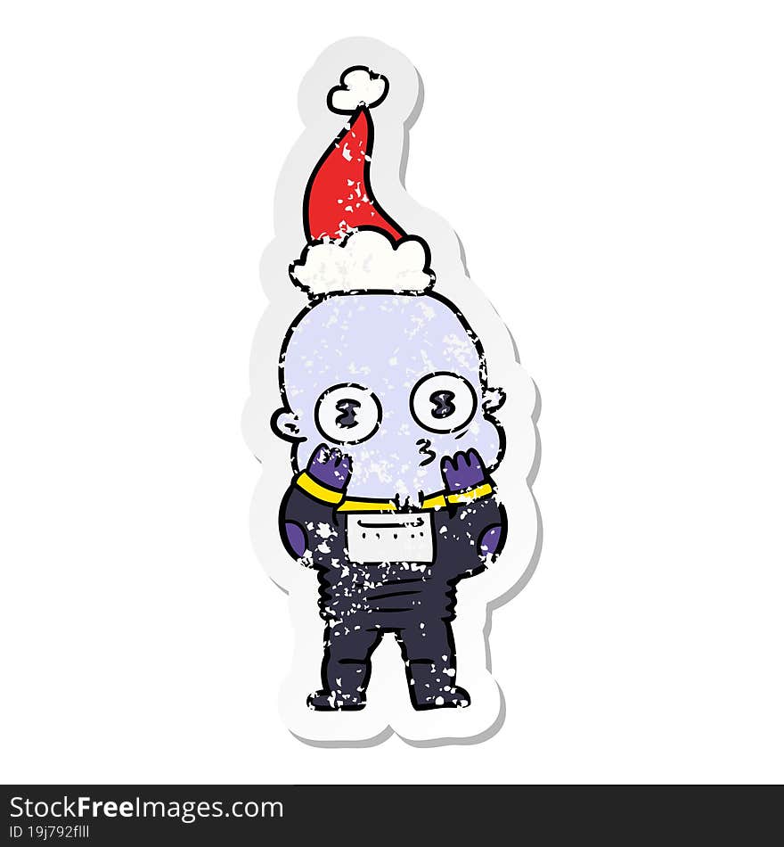 distressed sticker cartoon of a weird bald spaceman wearing santa hat