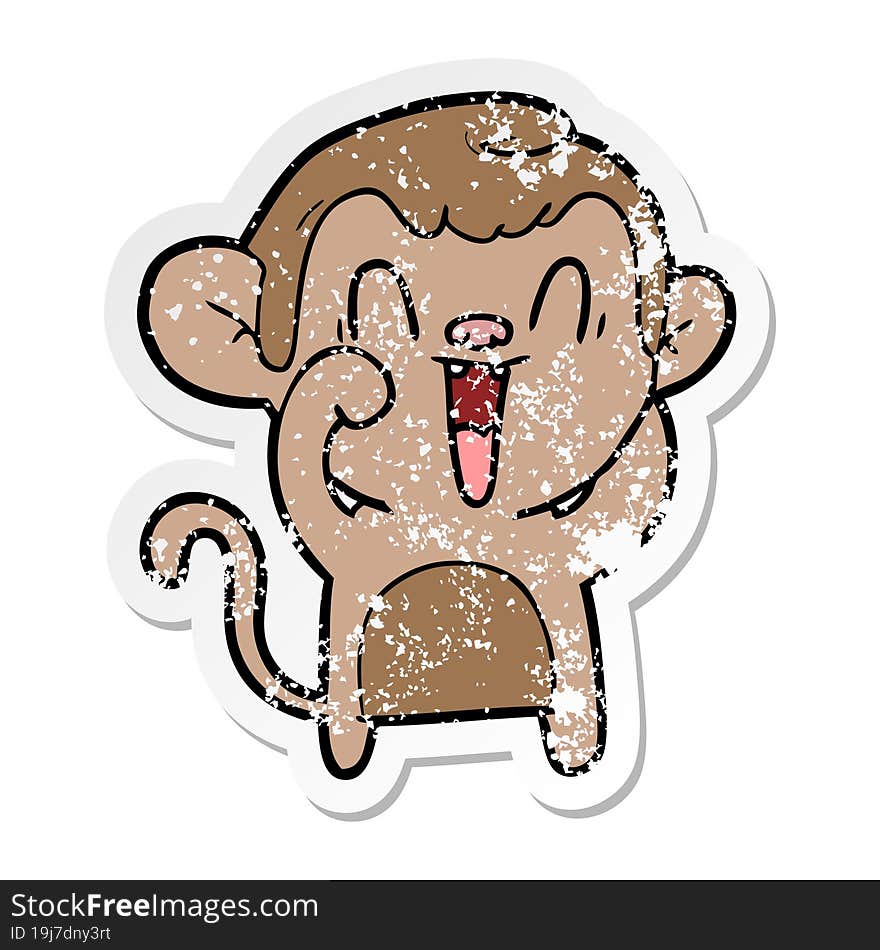 distressed sticker of a cartoon laughing monkey