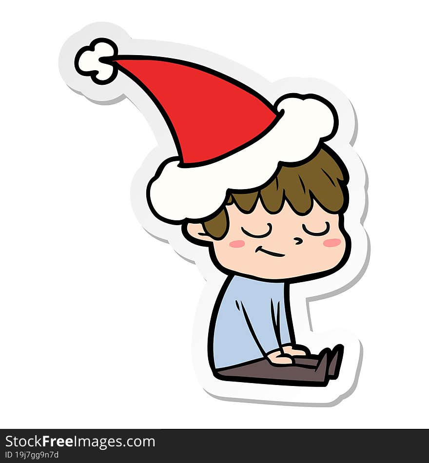 sticker cartoon of a happy boy wearing santa hat