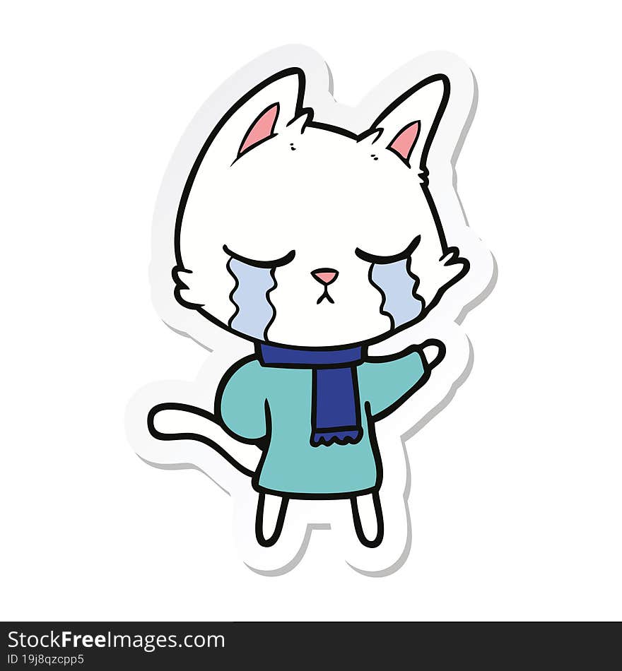 sticker of a crying cartoon cat wearing winter clothes