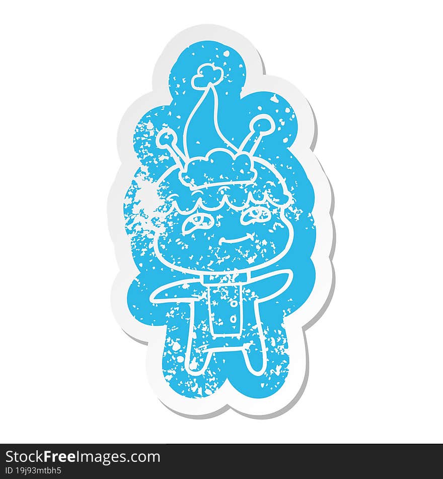 friendly cartoon distressed sticker of a spaceman wearing santa hat