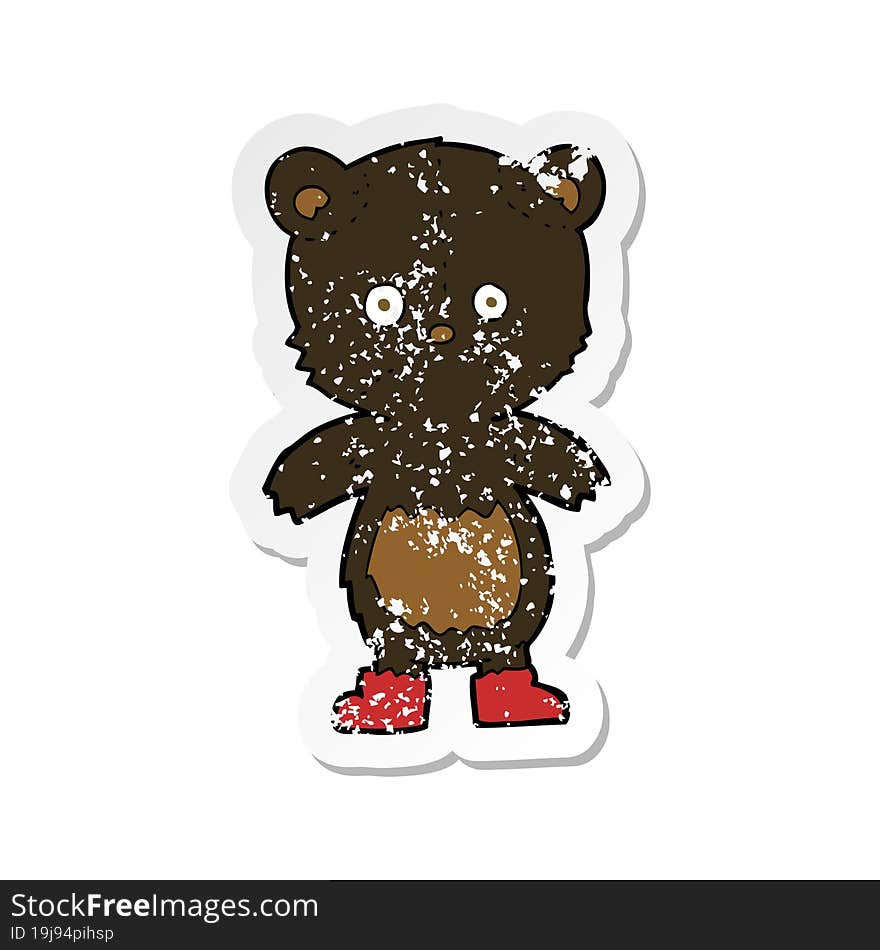 retro distressed sticker of a cartoon black bear cub