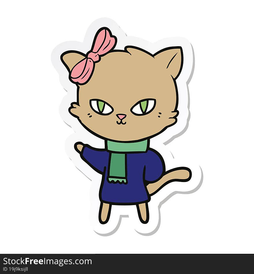 sticker of a cute cartoon cat in winter clothes