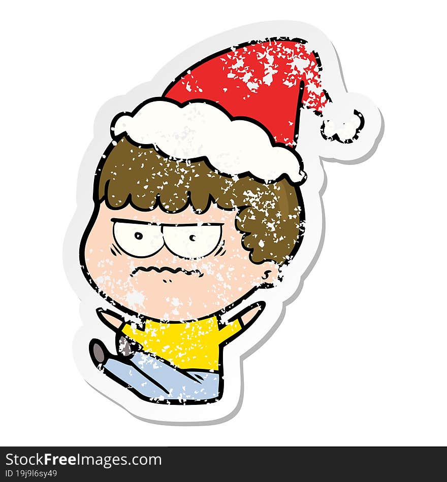 Distressed Sticker Cartoon Of A Annoyed Man Wearing Santa Hat