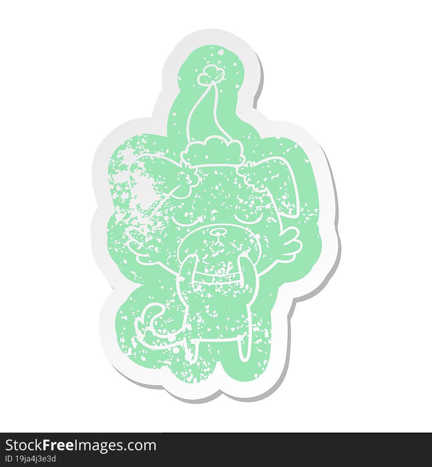 cute quirky cartoon distressed sticker of a dog wearing santa hat