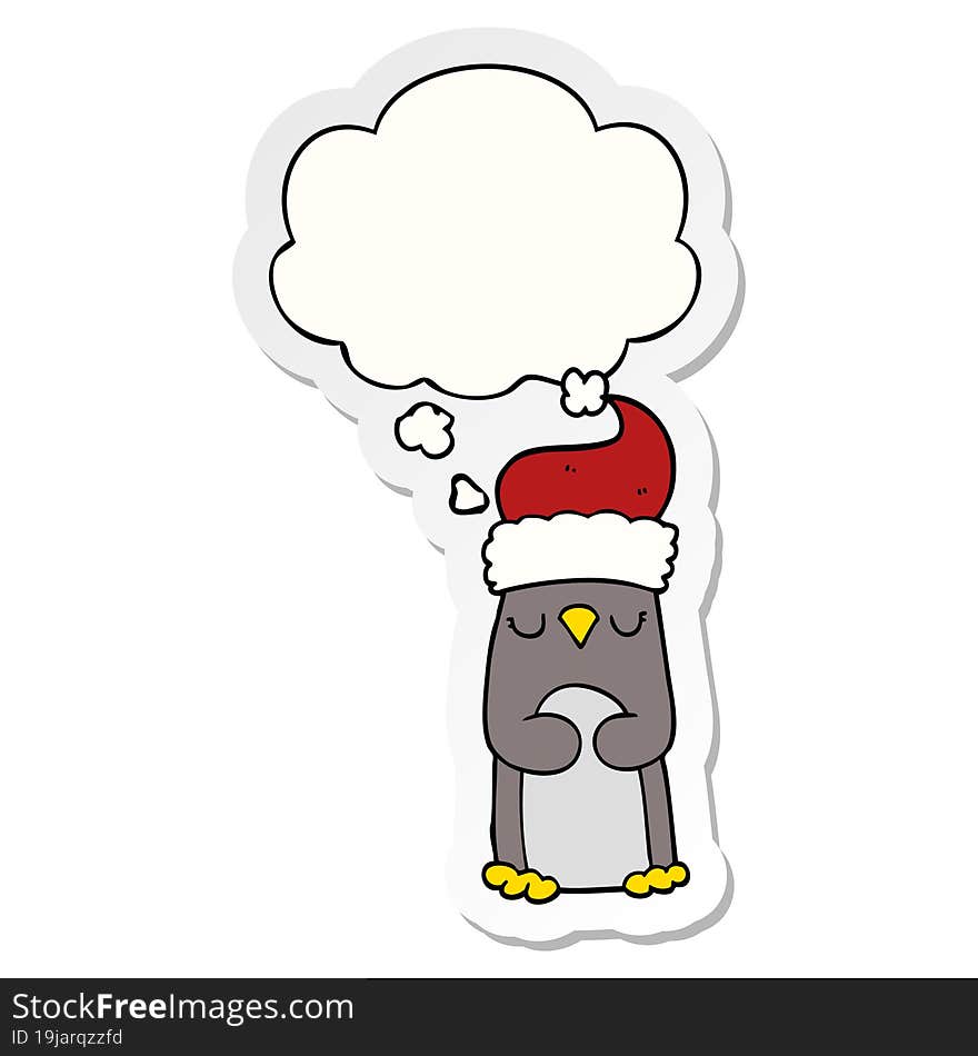 cartoon christmas penguin and thought bubble as a printed sticker