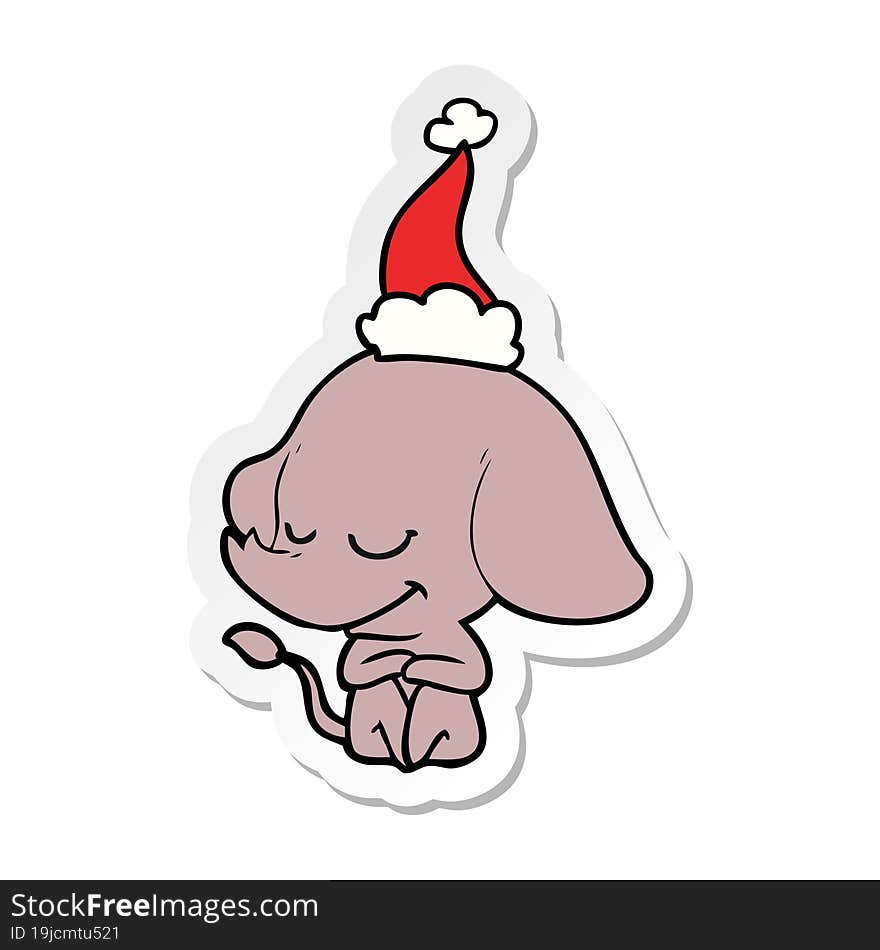 sticker cartoon of a smiling elephant wearing santa hat