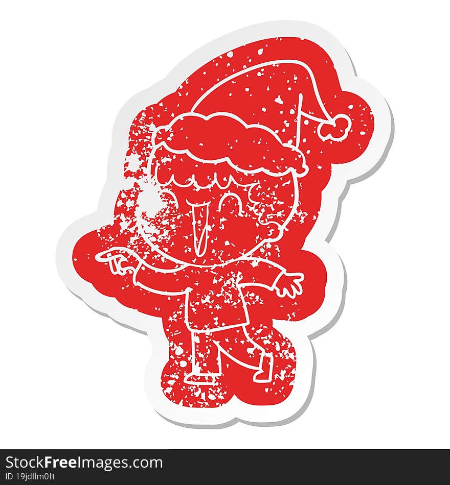 laughing quirky cartoon distressed sticker of a man pointing wearing santa hat