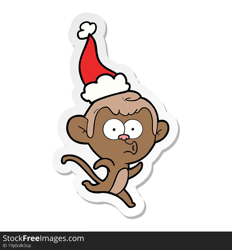 sticker cartoon of a surprised monkey wearing santa hat