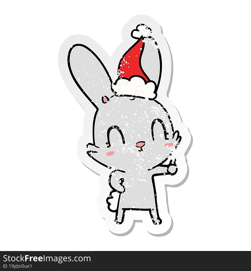 cute hand drawn distressed sticker cartoon of a rabbit wearing santa hat. cute hand drawn distressed sticker cartoon of a rabbit wearing santa hat