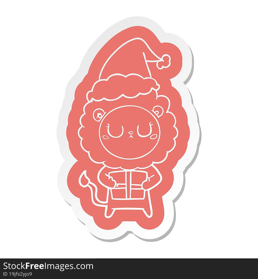 cartoon  sticker of a lion with christmas present wearing santa hat