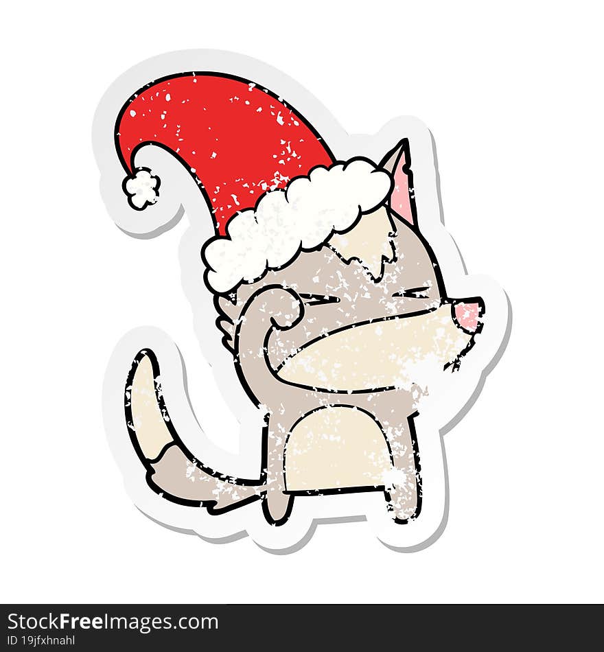 Distressed Sticker Of A Tired Wolf Cartoon Wearing Xmas Hat