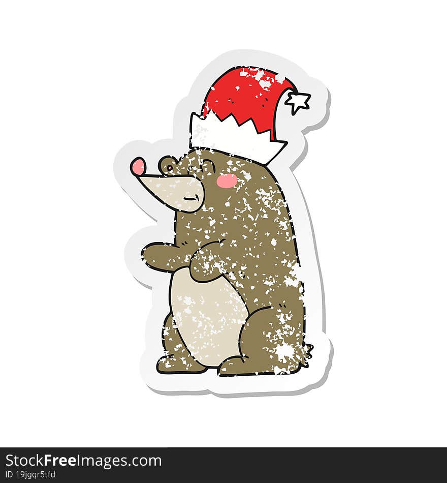 retro distressed sticker of a cartoon bear wearing christmas hat